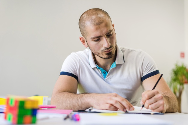 young-man-studying-alone_23-2147656036.jpg