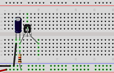 یک ترانزیستور، خازن و مقاومت روی یک برد الکترونیکی