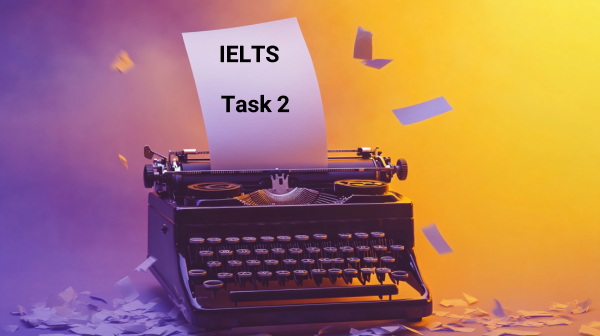 تصویر ماشین‌تحریر قدیمی که بر‌گه داخل آن است و نوشته شده IELTS Task 2