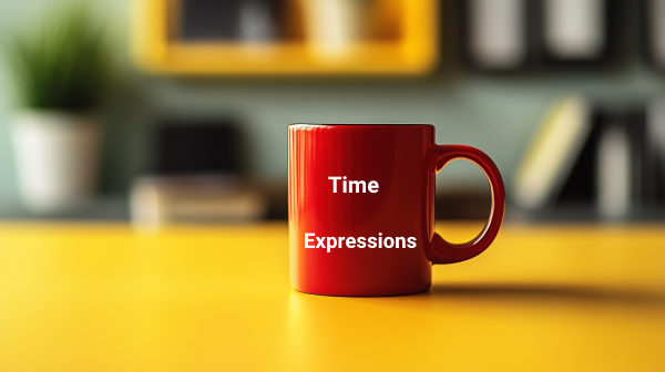 ماگی قرمز که روی آن نوشته شده Time Expressions