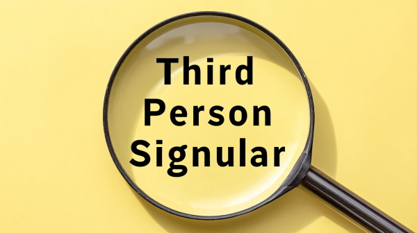 تصویر ذره‌بینی که روی نوشته «Third Person Singular» قرار دارد.