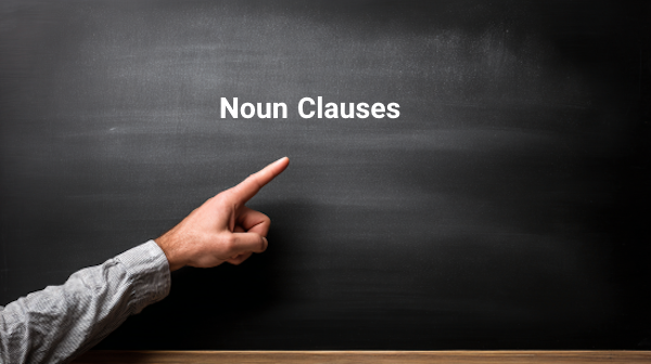 تصویر معلمی که به تخته اشاره دارد و روی آن نوشته noun clause